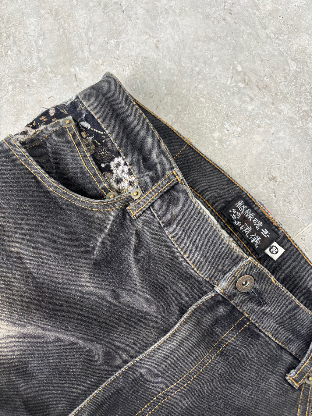 Karakuri black tab jeans with full dragon embroidery. Size 34–36.