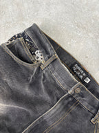 Karakuri black tab jeans with full dragon embroidery. Size 34–36.