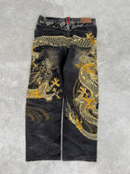 Karakuri black tab jeans with full dragon embroidery. Size 34–36.