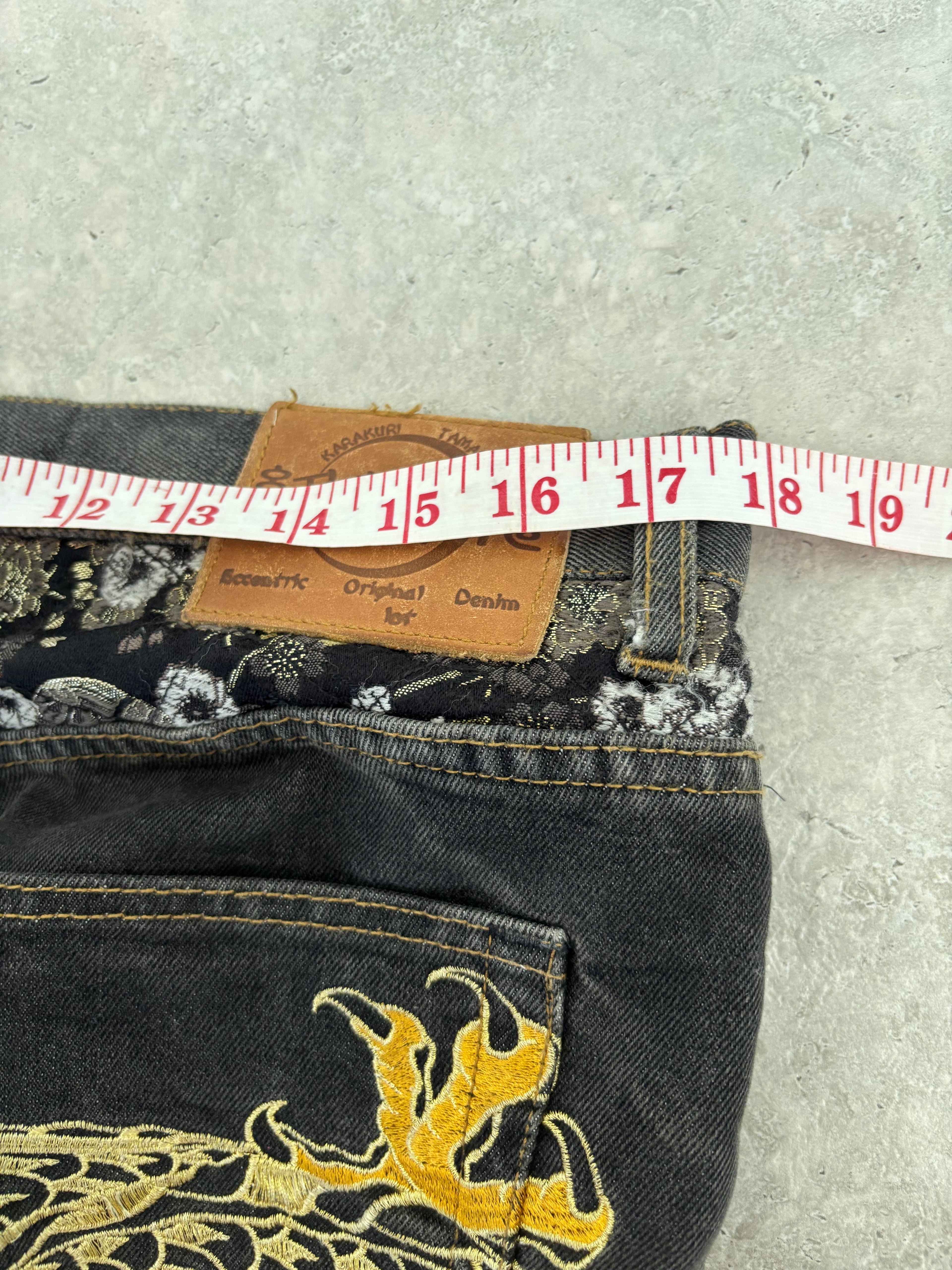 Karakuri black tab jeans with full dragon embroidery. Size 34–36.